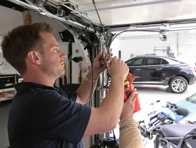 Bexley Garage Door Repair safety certified technician performing cable replacement in Bexley