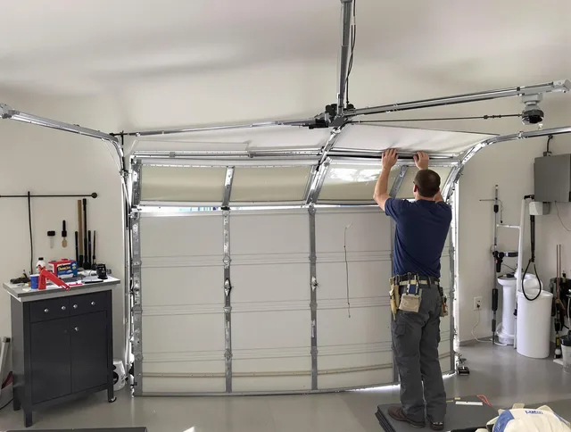 Bexley Garage Door Repair specialist performing precise section replacement on Bexley garage door